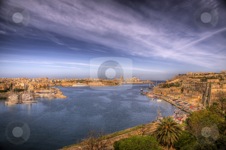 To use this stock image in your creative project, please select the size you need over to the right and click the "Add to Cart" button.
Your downloaded image will come with the Cutcaster watermark removed so don’t worry about the watermark you see on this page. A Maltese Bay stock photo, A busy port on the coast of Malta by Stephen Kiernan
