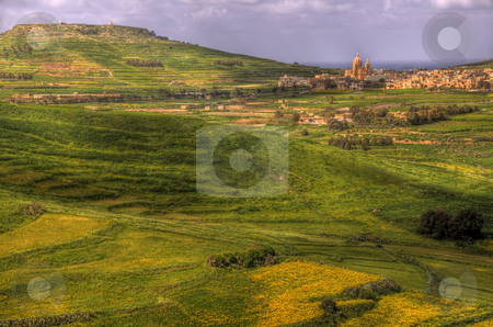 To use this stock image in your creative project, please select the size you need over to the right and click the "Add to Cart" button.
Your downloaded image will come with the Cutcaster watermark removed so don’t worry about the watermark you see on this page. Green fields in Malta stock photo, A scenic view of fields on Gozo near the town of Rabat. by Stephen Kiernan