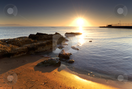 To use this stock image in your creative project, please select the size you need over to the right and click the "Add to Cart" button.
Your downloaded image will come with the Cutcaster watermark removed so don’t worry about the watermark you see on this page. Mediterranean sunrise stock photo, A very bright sunrise over a Mediterranean rocky seascape. by Andreas Karelias