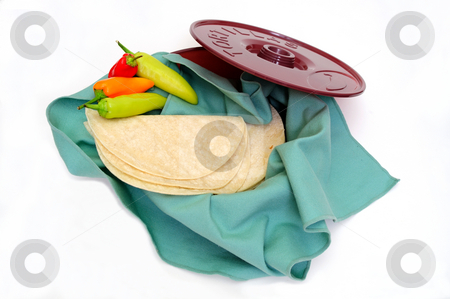 To use this stock image in your creative project, please select the size you need over to the right and click the "Add to Cart" button.
Your downloaded image will come with the Cutcaster watermark removed so don’t worry about the watermark you see on this page. Tortilla Wamer And Tortillas stock photo, Plastic tortilla warmer and tortillas on a white background. by Lynn Bendickson