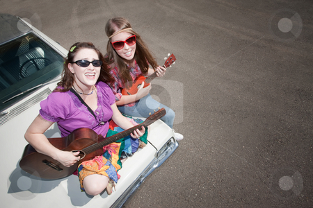 To use this stock image in your creative project, please select the size you need over to the right and click the "Add to Cart" button.
Your downloaded image will come with the Cutcaster watermark removed so don’t worry about the watermark you see on this page. Female Musicians stock photo, Female Musicians on an Old Car by Scott Griessel