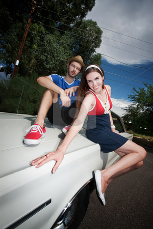 To use this stock image in your creative project, please select the size you need over to the right and click the "Add to Cart" button.
Your downloaded image will come with the Cutcaster watermark removed so don’t worry about the watermark you see on this page. Hipster Couple stock photo, Hipster Couple Sitting on an Old Car by Scott Griessel