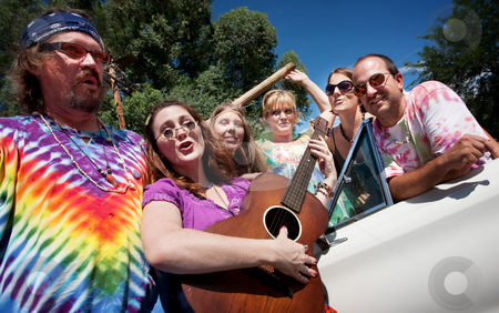 To use this stock image in your creative project, please select the size you need over to the right and click the "Add to Cart" button.
Your downloaded image will come with the Cutcaster watermark removed so don’t worry about the watermark you see on this page. Singing Groups of Friends stock photo, Group of hippies with female guitar player by Scott Griessel