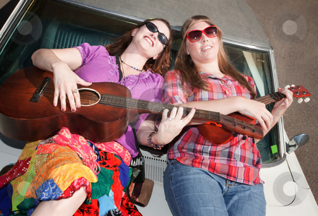 To use this stock image in your creative project, please select the size you need over to the right and click the "Add to Cart" button.
Your downloaded image will come with the Cutcaster watermark removed so don’t worry about the watermark you see on this page. Female Musicians stock photo, Female Musicians on an Old Car by Scott Griessel