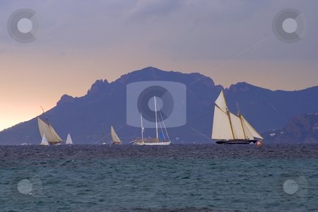 To use this stock image in your creative project, please select the size you need over to the right and click the "Add to Cart" button.
Your downloaded image will come with the Cutcaster watermark removed so don’t worry about the watermark you see on this page. Regattas under storm stock photo, Old sailboats in Cannes bay during