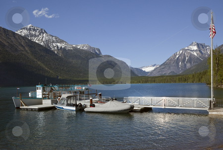 To use this stock image in your creative project, please select the size you need over to the right and click the "Add to Cart" button.
Your downloaded image will come with the Cutcaster watermark removed so don’t worry about the watermark you see on this page. Lake McDonald Boats Glacier National Park stock photo, Lake McDonald Boats Snow Mountains at Glacier National Park by William Perry