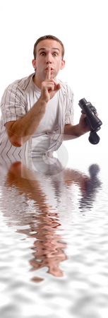 To use this stock image in your creative project, please select the size you need over to the right and click the "Add to Cart" button.
Your downloaded image will come with the Cutcaster watermark removed so don’t worry about the watermark you see on this page. Chest Deep stock photo, A young man standing chest deep in some water, while holding a set of binoculars by Richard Nelson