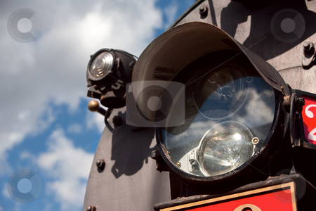 To use this stock image in your creative project, please select the size you need over to the right and click the "Add to Cart" button.
Your downloaded image will come with the Cutcaster watermark removed so don’t worry about the watermark you see on this page. Light on the Front of Train stock photo, Light on the front of vintage steam engine train by Scott Griessel