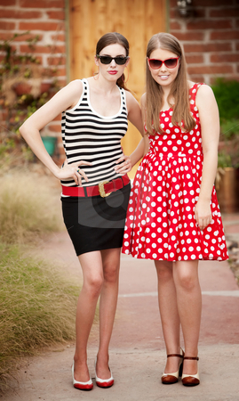 To use this stock image in your creative project, please select the size you need over to the right and click the "Add to Cart" button.
Your downloaded image will come with the Cutcaster watermark removed so don’t worry about the watermark you see on this page. Fashion Girls stock photo, Fashion Girls on Walkway in front of House by Scott Griessel