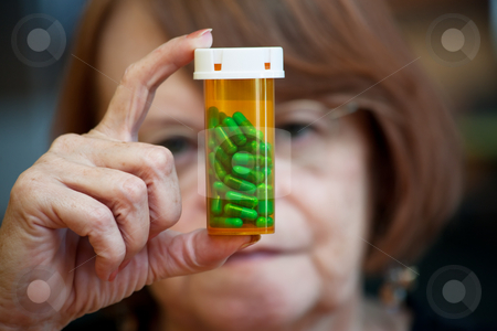 To use this stock image in your creative project, please select the size you need over to the right and click the "Add to Cart" button.
Your downloaded image will come with the Cutcaster watermark removed so don’t worry about the watermark you see on this page. Woman reading instructions on pill bottle stock photo, Confused woman reading instructions on prescription pill bottle by Scott Griessel