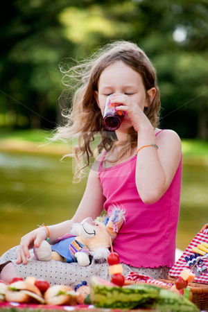 To use this stock image in your creative project, please select the size you need over to the right and click the "Add to Cart" button.
Your downloaded image will come with the Cutcaster watermark removed so don’t worry about the watermark you see on this page. Drinking some juice stock photo, Teenagers having a great time in the park by Frenk and Danielle Kaufmann
