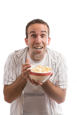 To use this stock image in your creative project, please select the size you need over to the right and click the "Add to Cart" button.
Your downloaded image will come with the Cutcaster watermark removed so don’t worry about the watermark you see on this page. Popcorn stock photo, A young man holding a bowl of popcorn and watching a movie, isolated against a white background by Richard Nelson