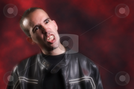 To use this stock image in your creative project, please select the size you need over to the right and click the "Add to Cart" button.
Your downloaded image will come with the Cutcaster watermark removed so don’t worry about the watermark you see on this page. Modern Vampire stock photo, A modern day vampire is baring his teeth because he is thirsty for blood by Richard Nelson