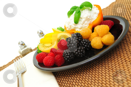 To use this stock image in your creative project, please select the size you need over to the right and click the "Add to Cart" button.
Your downloaded image will come with the Cutcaster watermark removed so don’t worry about the watermark you see on this page. Berry And Cottage Cheese Salad stock photo, Lo-cal salad made with red and golden raspberries, blackberries, yellow heirloom tomatoes with an orange bell pepper filled with cottage cheese topped with fresh basil by Lynn Bendickson