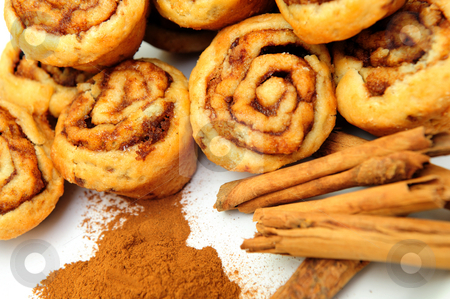 To use this stock image in your creative project, please select the size you need over to the right and click the "Add to Cart" button.
Your downloaded image will come with the Cutcaster watermark removed so don’t worry about the watermark you see on this page. Cinnamon And Rolls stock photo, Powdered and stick cinnamon with fresh baked mini cinnamon rolls by Lynn Bendickson