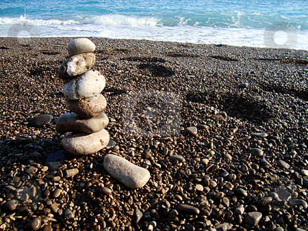 To use this stock image in your creative project, please select the size you need over to the right and click the "Add to Cart" button.
Your downloaded image will come with the Cutcaster watermark removed so don’t worry about the watermark you see on this page. Stone beach stock photo, Stones tower on the coast line of mediterranean beach by Marc Torrell