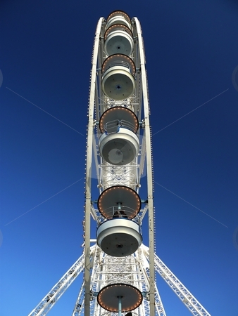 To use this stock image in your creative project, please select the size you need over to the right and click the "Add to Cart" button.
Your downloaded image will come with the Cutcaster watermark removed so don’t worry about the watermark you see on this page. Ferris Wheel - sideview stock photo, Ferris Wheel with blue sky background - sideview by Milos Pavlovsky