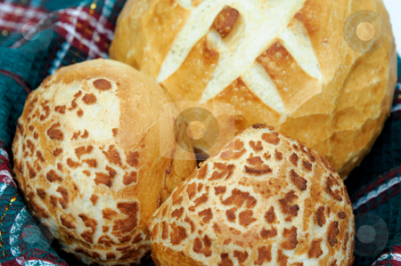 To use this stock image in your creative project, please select the size you need over to the right and click the "Add to Cart" button.
Your downloaded image will come with the Cutcaster watermark removed so don’t worry about the watermark you see on this page. Bread And Rolls stock photo, Loaf of sourdough bread and 2 rolls in a basket lined with a green cloth by Lynn Bendickson