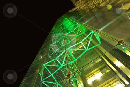 To use this stock image in your creative project, please select the size you need over to the right and click the "Add to Cart" button.
Your downloaded image will come with the Cutcaster watermark removed so don’t worry about the watermark you see on this page. Office building at night with glass walls illuminated with green stock photo, A facade of office building shot at wide angle. hi-tech style metal construction is seen through the glass, illuminated with green light by Elizaveta Geshiktor