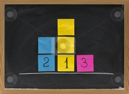 To use this stock image in your creative project, please select the size you need over to the right and click the "Add to Cart" button.
Your downloaded image will come with the Cutcaster watermark removed so don’t worry about the watermark you see on this page. Representation of three level podium on blackboard stock photo, Concept of three level podium to honor medalists in sporting events presented with sticky notes on blackboard by Marek Uliasz