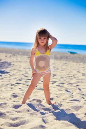 To use this stock image in your creative project, please select the size you need over to the right and click the "Add to Cart" button.
Your downloaded image will come with the Cutcaster watermark removed so don’t worry about the watermark you see on this page. Funny girl on a beach stock photo, Funny little girl wearing swimsuit on a beach by Natalia Macheda