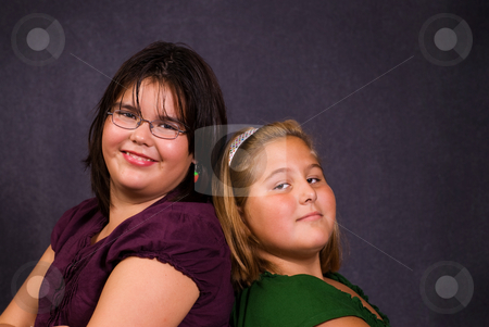 To use this stock image in your creative project, please select the size you need over to the right and click the "Add to Cart" button.
Your downloaded image will come with the Cutcaster watermark removed so don’t worry about the watermark you see on this page. Friendship stock photo, Two best friends leaning against each other back to back by Richard Nelson