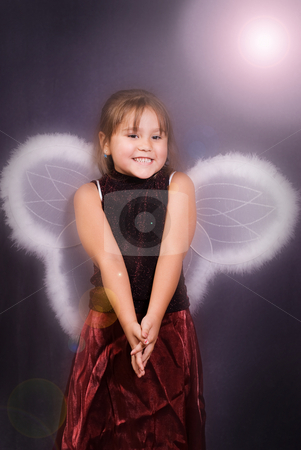 To use this stock image in your creative project, please select the size you need over to the right and click the "Add to Cart" button.
Your downloaded image will come with the Cutcaster watermark removed so don’t worry about the watermark you see on this page. 4 Year Old Angel stock photo, A young girl dressed in wings pretending to be an angerl by Richard Nelson