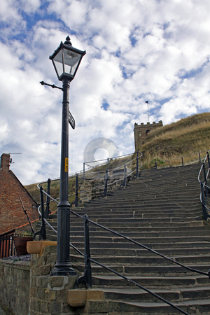 To use this stock image in your creative project, please select the size you need over to the right and click the "Add to Cart" button.
Your downloaded image will come with the Cutcaster watermark removed so don’t worry about the watermark you see on this page. 199 Steps Whitby stock photo, Low angle view of 199 steps leading up to Saint Marys Church and Whitby Abbey, North Yorkshire, England. by Martin Crowdy