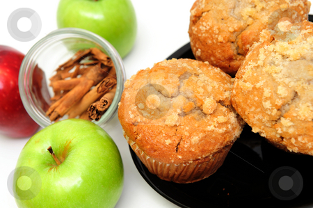 To use this stock image in your creative project, please select the size you need over to the right and click the "Add to Cart" button.
Your downloaded image will come with the Cutcaster watermark removed so don’t worry about the watermark you see on this page. Apple Muffins stock photo, Apple Spice muffins on a white background with 2 green granny smith, one red apple and cinnamon sticks by Lynn Bendickson