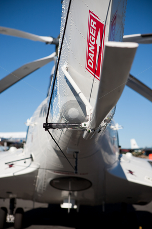 To use this stock image in your creative project, please select the size you need over to the right and click the "Add to Cart" button.
Your downloaded image will come with the Cutcaster watermark removed so don’t worry about the watermark you see on this page. Tail sign stock photo, Red dnger sign on the tail of a white helicopter fuselage by Ian Genis