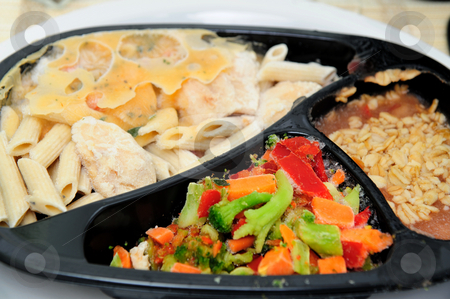 To use this stock image in your creative project, please select the size you need over to the right and click the "Add to Cart" button.
Your downloaded image will come with the Cutcaster watermark removed so don’t worry about the watermark you see on this page. Frozen Dinner stock photo, Instant frozen microwave dinner with pasta and chicken a side of vegetables and dessert by Lynn Bendickson