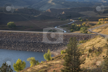 To use this stock image in your creative project, please select the size you need over to the right and click the "Add to Cart" button.
Your downloaded image will come with the Cutcaster watermark removed so don’t worry about the watermark you see on this page. Rock dam on mountain reservoir in Colorado stock photo, Rock dam on Horsetooth Reservoir at foothills of Rocky Mountains near Fort Collins, Colorado, Charles Canal below the dam is running water, early fall by Marek Uliasz