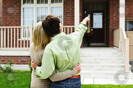 To use this stock image in your creative project, please select the size you need over to the right and click the "Add to Cart" button.
Your downloaded image will come with the Cutcaster watermark removed so don’t worry about the watermark you see on this page. Happy couple in front of home stock photo, Young happy couple shopping for new home by Elena Elisseeva