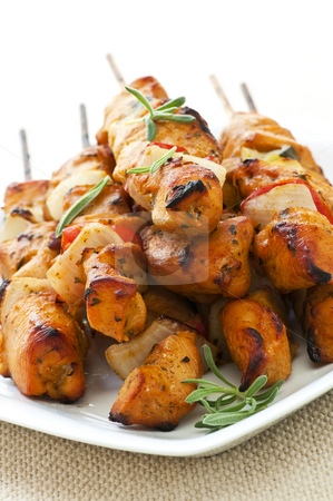 To use this stock image in your creative project, please select the size you need over to the right and click the "Add to Cart" button.
Your downloaded image will come with the Cutcaster watermark removed so don’t worry about the watermark you see on this page. Chicken skewers stock photo, Pile of barbecued chicken kebab appetizers on a plate by Elena Elisseeva