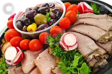 To use this stock image in your creative project, please select the size you need over to the right and click the "Add to Cart" button.
Your downloaded image will come with the Cutcaster watermark removed so don’t worry about the watermark you see on this page. Cold cut platter stock photo, Platter of assorted cold cut meat slices by Elena Elisseeva