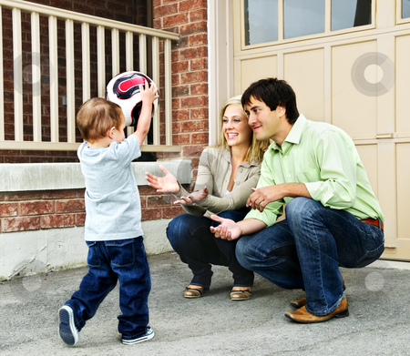 To use this stock image in your creative project, please select the size you need over to the right and click the "Add to Cart" button.
Your downloaded image will come with the Cutcaster watermark removed so don’t worry about the watermark you see on this page. Family playing with soccer ball stock photo, Happy young family playing soccer with toddler on driveway by Elena Elisseeva