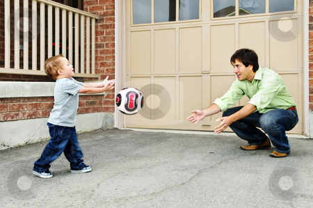 To use this stock image in your creative project, please select the size you need over to the right and click the "Add to Cart" button.
Your downloaded image will come with the Cutcaster watermark removed so don’t worry about the watermark you see on this page. Father and son playing soccer stock photo, Father teaching son to play soccer on driveway by Elena Elisseeva