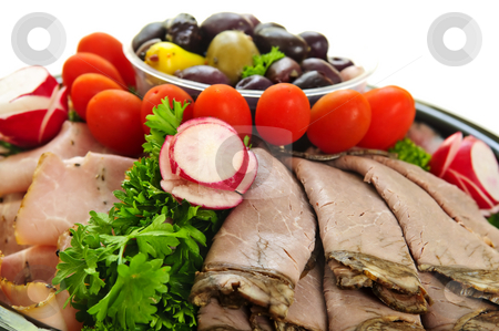 To use this stock image in your creative project, please select the size you need over to the right and click the "Add to Cart" button.
Your downloaded image will come with the Cutcaster watermark removed so don’t worry about the watermark you see on this page. Cold cut platter stock photo, Platter of assorted cold cut meat slices by Elena Elisseeva