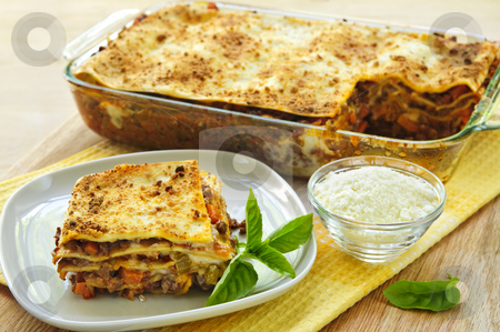 To use this stock image in your creative project, please select the size you need over to the right and click the "Add to Cart" button.
Your downloaded image will come with the Cutcaster watermark removed so don’t worry about the watermark you see on this page. Lasagna stock photo, Fresh baked lasagna casserole with a serving cut by Elena Elisseeva