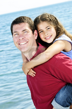 To use this stock image in your creative project, please select the size you need over to the right and click the "Add to Cart" button.
Your downloaded image will come with the Cutcaster watermark removed so don’t worry about the watermark you see on this page. Father and daughter stock photo, Portrait of father giving piggyback ride to daughter at seashore by Elena Elisseeva