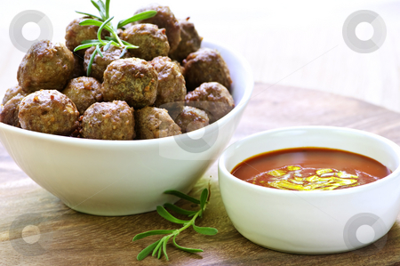 To use this stock image in your creative project, please select the size you need over to the right and click the "Add to Cart" button.
Your downloaded image will come with the Cutcaster watermark removed so don’t worry about the watermark you see on this page. Meatballs and sauce stock photo, Fresh hot meatball appetizers served in white bowl with dipping sauce by Elena Elisseeva