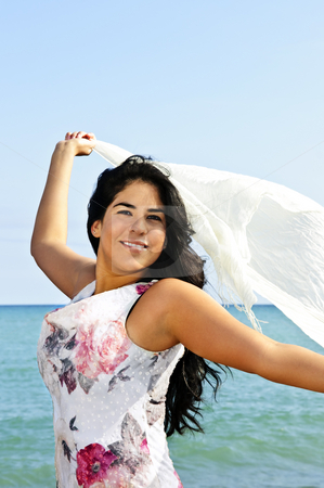 To use this stock image in your creative project, please select the size you need over to the right and click the "Add to Cart" button.
Your downloaded image will come with the Cutcaster watermark removed so don’t worry about the watermark you see on this page. Beautiful young woman at beach with white scarf stock photo, Portrait of beautiful smiling brunette girl at beach holding white scarf by Elena Elisseeva