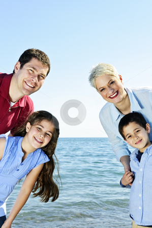 To use this stock image in your creative project, please select the size you need over to the right and click the "Add to Cart" button.
Your downloaded image will come with the Cutcaster watermark removed so don’t worry about the watermark you see on this page. Happy family stock photo, Welcoming happy family of four at lake by Elena Elisseeva
