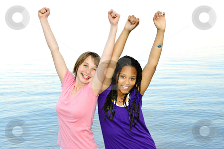 To use this stock image in your creative project, please select the size you need over to the right and click the "Add to Cart" button.
Your downloaded image will come with the Cutcaster watermark removed so don’t worry about the watermark you see on this page. Happy girlfriends stock photo, Portrait of two teenage girl friends raising arms by Elena Elisseeva