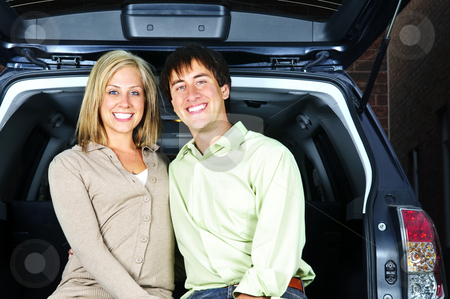 To use this stock image in your creative project, please select the size you need over to the right and click the "Add to Cart" button.
Your downloaded image will come with the Cutcaster watermark removed so don’t worry about the watermark you see on this page. Couple sitting in back of car stock photo, Happy young couple sitting at back of car by Elena Elisseeva