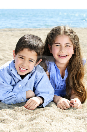 To use this stock image in your creative project, please select the size you need over to the right and click the "Add to Cart" button.
Your downloaded image will come with the Cutcaster watermark removed so don’t worry about the watermark you see on this page. Brother and sister at beach stock photo, Portrait of brother and sister laying on sand at the beach by Elena Elisseeva