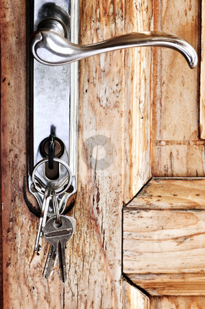 To use this stock image in your creative project, please select the size you need over to the right and click the "Add to Cart" button.
Your downloaded image will come with the Cutcaster watermark removed so don’t worry about the watermark you see on this page. Door handle with keys stock photo, Set of keys in lock of old wooden door by Elena Elisseeva