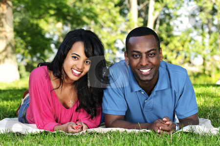 To use this stock image in your creative project, please select the size you need over to the right and click the "Add to Cart" button.
Your downloaded image will come with the Cutcaster watermark removed so don’t worry about the watermark you see on this page. Happy couple in park stock photo, Young romantic couple enjoying summer day in park by Elena Elisseeva