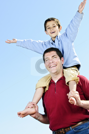 To use this stock image in your creative project, please select the size you need over to the right and click the "Add to Cart" button.
Your downloaded image will come with the Cutcaster watermark removed so don’t worry about the watermark you see on this page. Father and son stock photo, Portrait of father giving shoulder ride to son by Elena Elisseeva