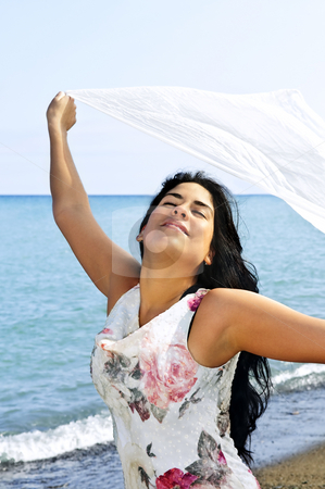 To use this stock image in your creative project, please select the size you need over to the right and click the "Add to Cart" button.
Your downloaded image will come with the Cutcaster watermark removed so don’t worry about the watermark you see on this page. Beautiful young woman at beach with white scarf stock photo, Portrait of beautiful smiling brunette girl at beach holding white scarf by Elena Elisseeva